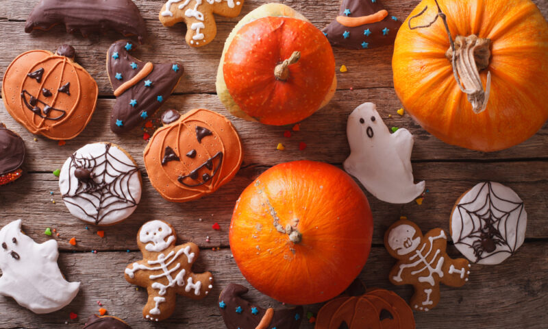 Beautiful gingerbread and fresh pumpkin on the table